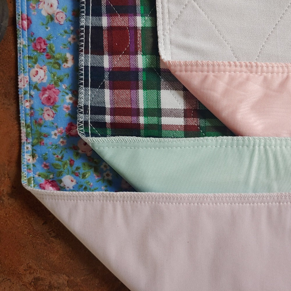 assorted Style large washable puppy pet pads in white, floral and blue plaid